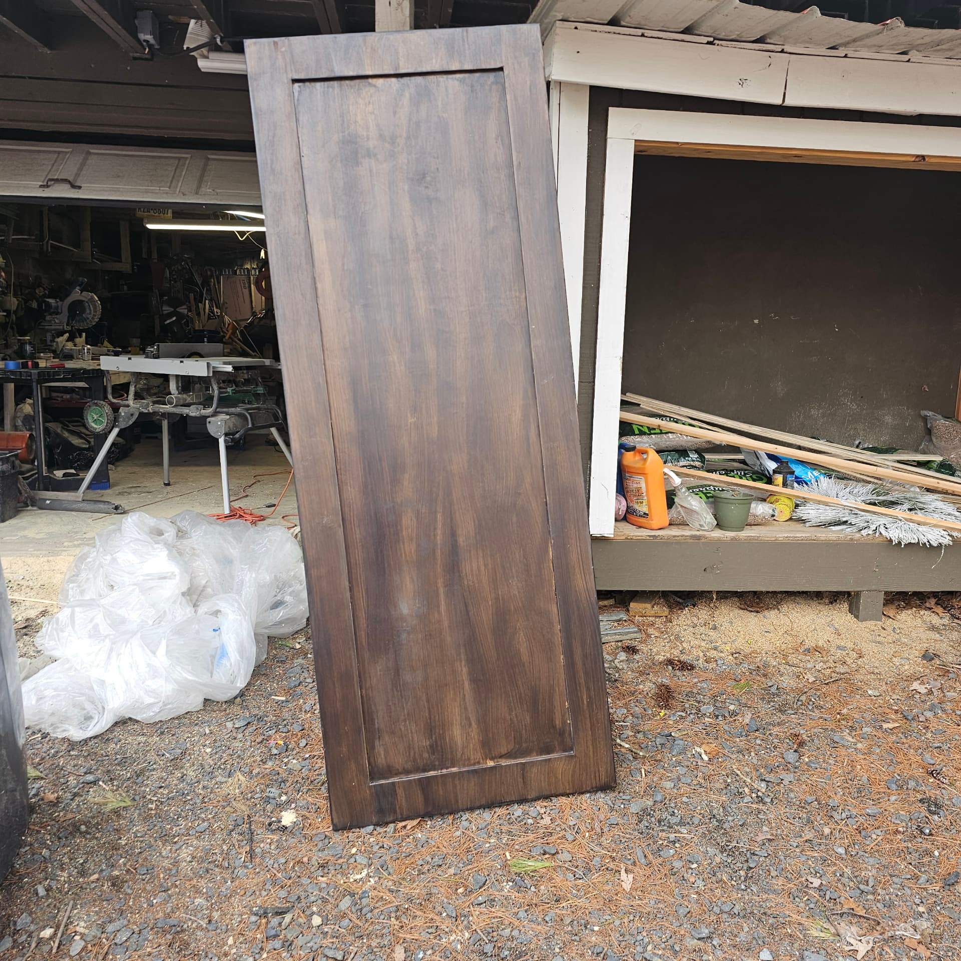 Door panel stained to a dark wood finish